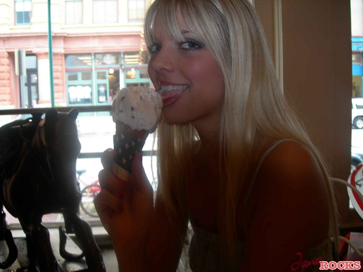 Blonde teen Jana Jordan licks an ice cream cone before straddling a toy horse  